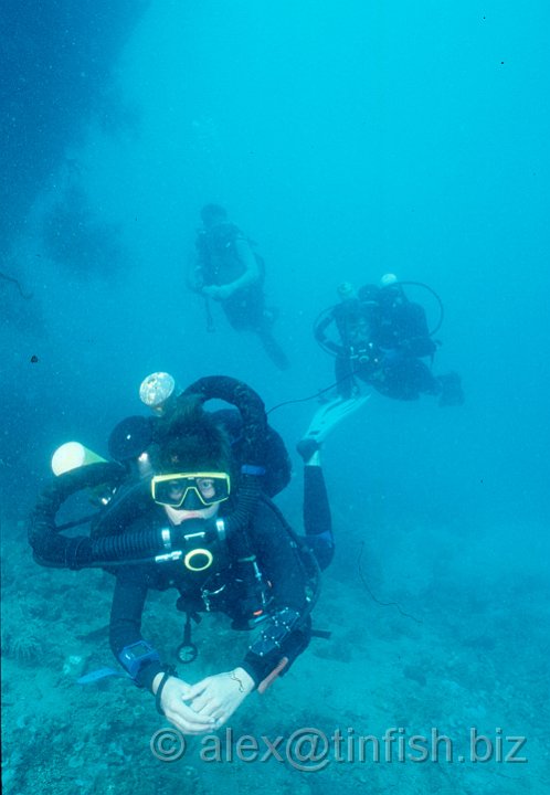 3 pack.jpg - Divers swimming around the Gunboat